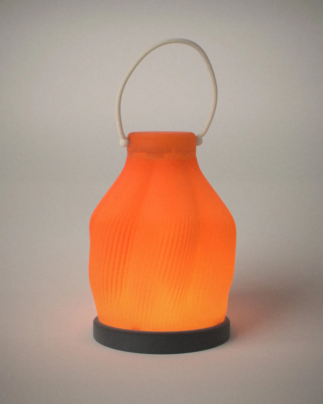 Andon cordless lamp, on a plain grey backdrop