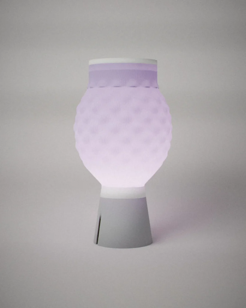 Awa, lit, on a pale grey wall