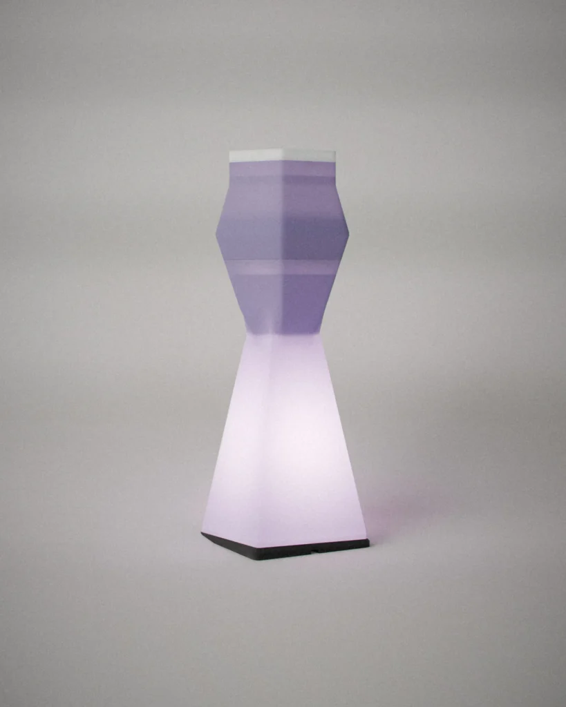 Beacon, lit, on a pale grey wall