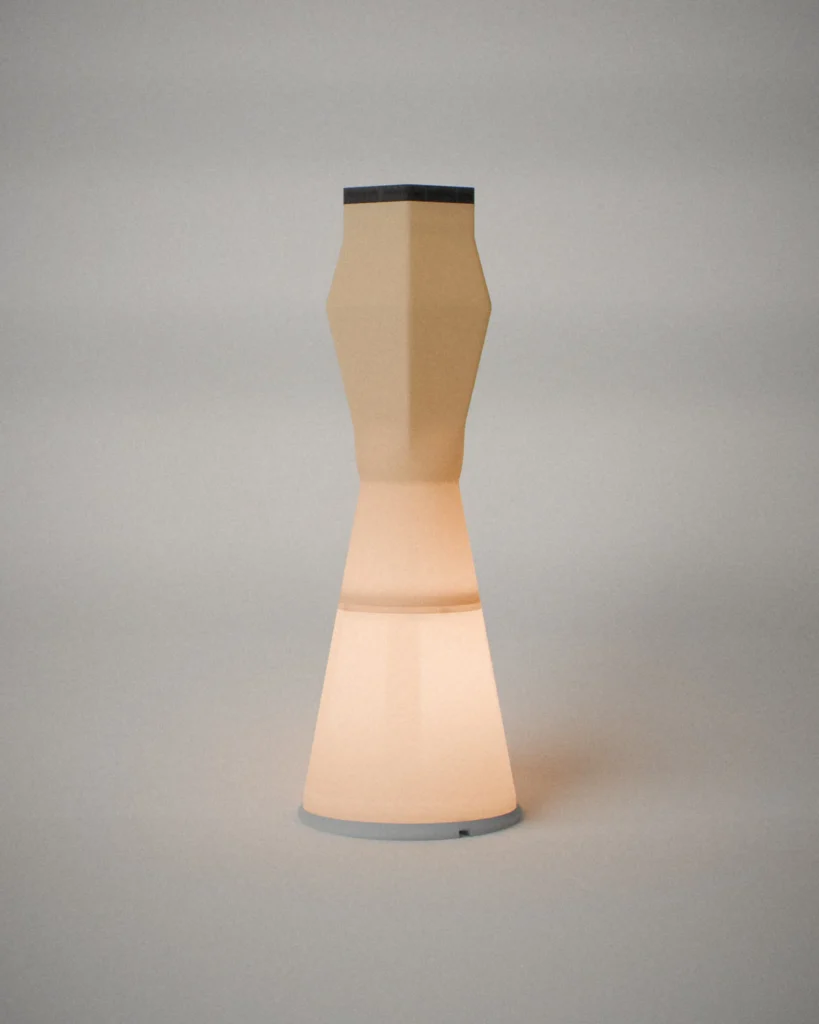 Beaker, lit, on a pale grey wall