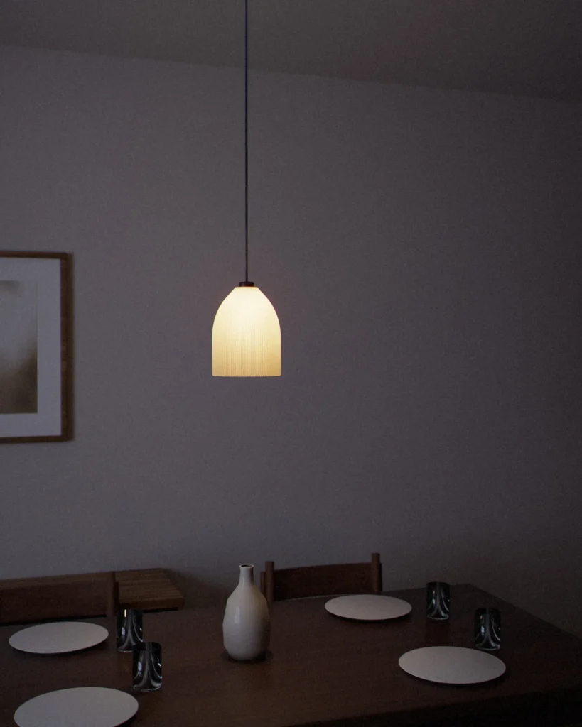 Bell lit in a furnished room in the evening