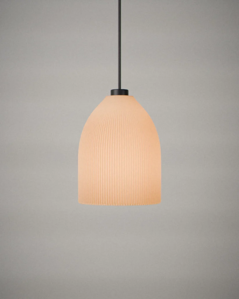 Bell, lit, on a pale grey wall