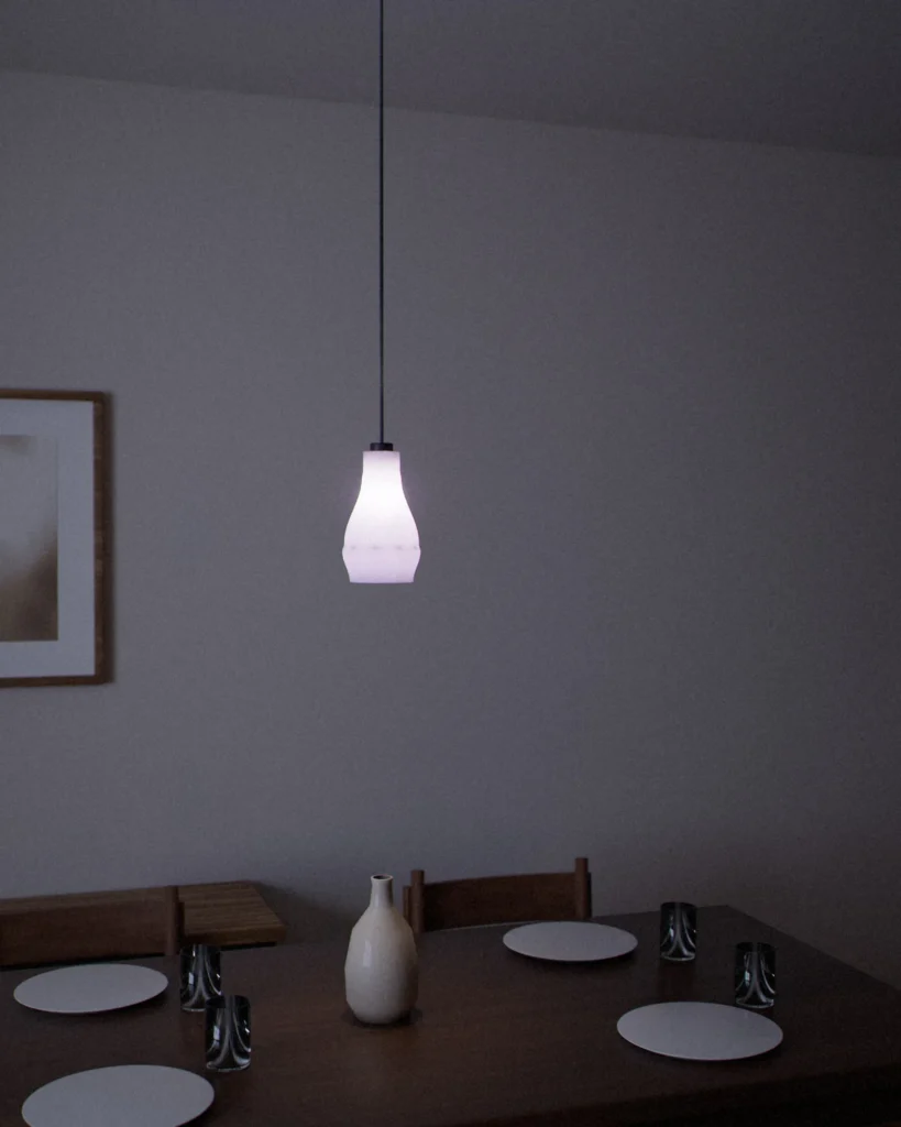 Bottle lit in a furnished room in the evening