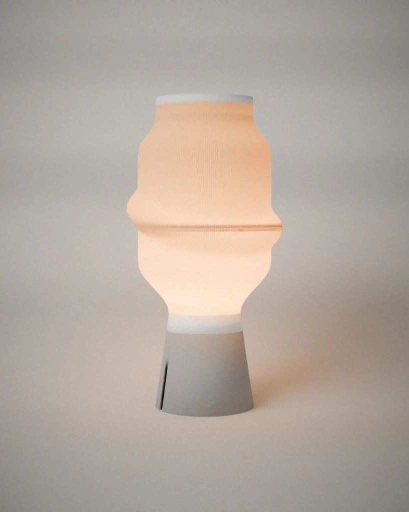 Capsule, lit, on a pale grey wall