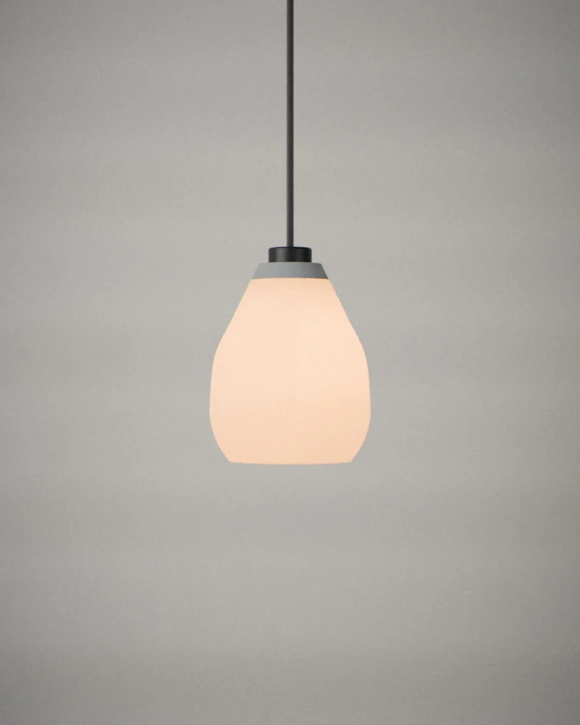 Cocoon, lit, on a pale grey wall