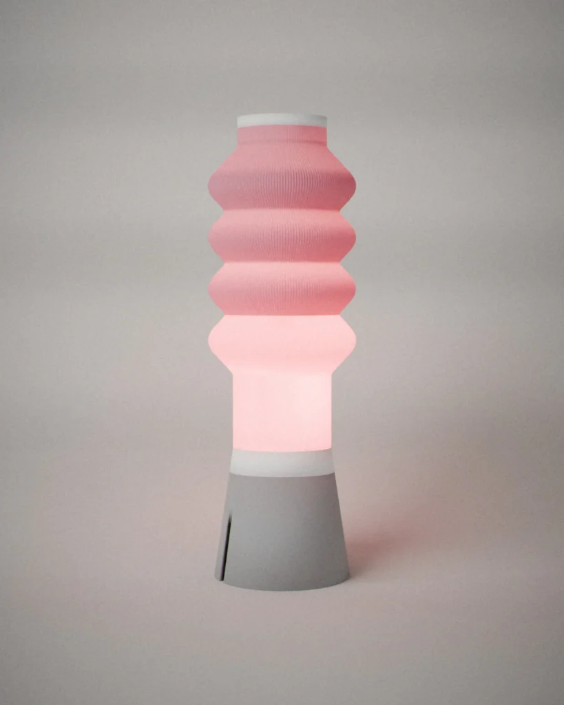 Dango, lit, on a pale grey wall