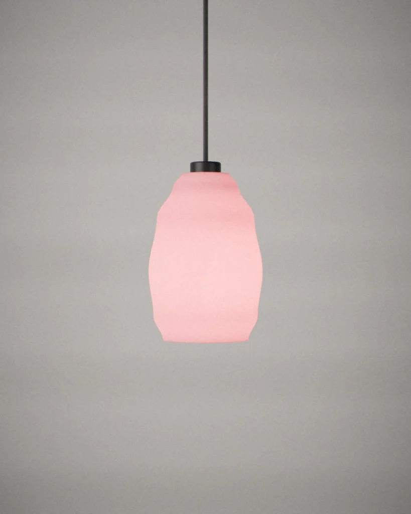Egg, lit, on a pale grey wall