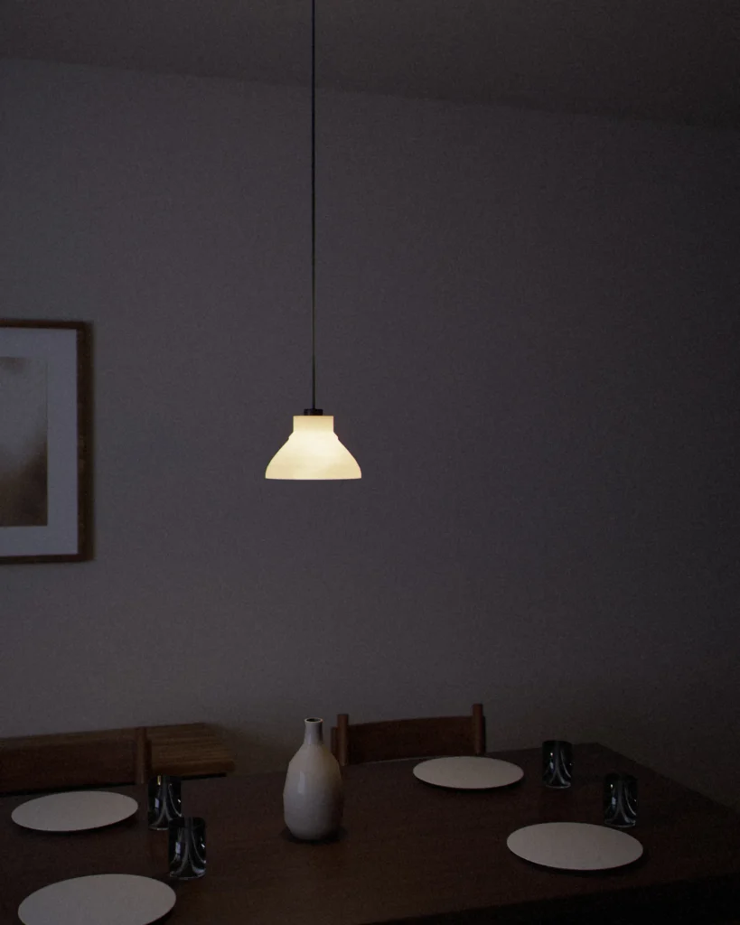Hachi lit in a furnished room in the evening