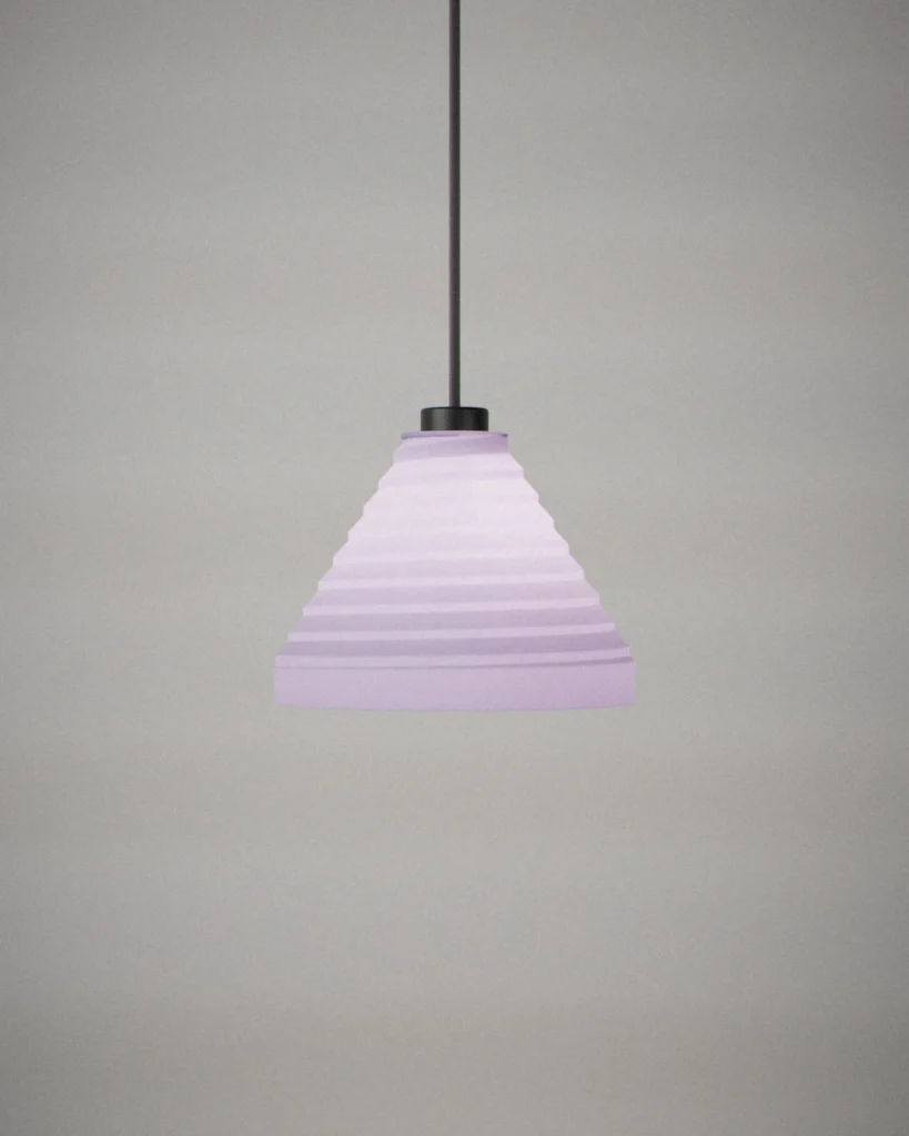 Hamon, lit, on a pale grey wall