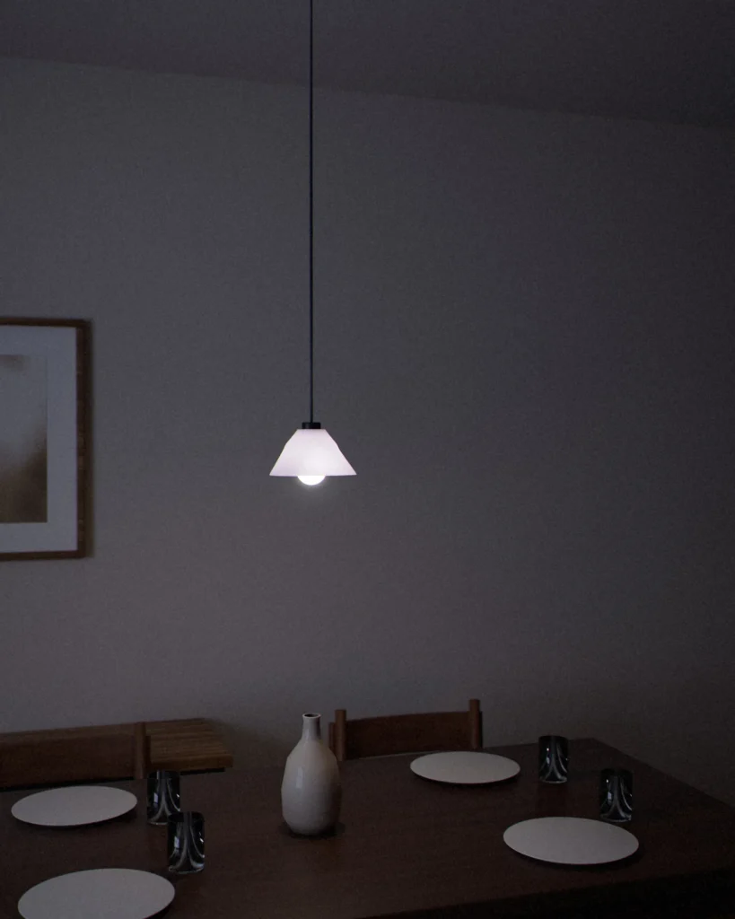 Hat lit in a furnished room in the evening