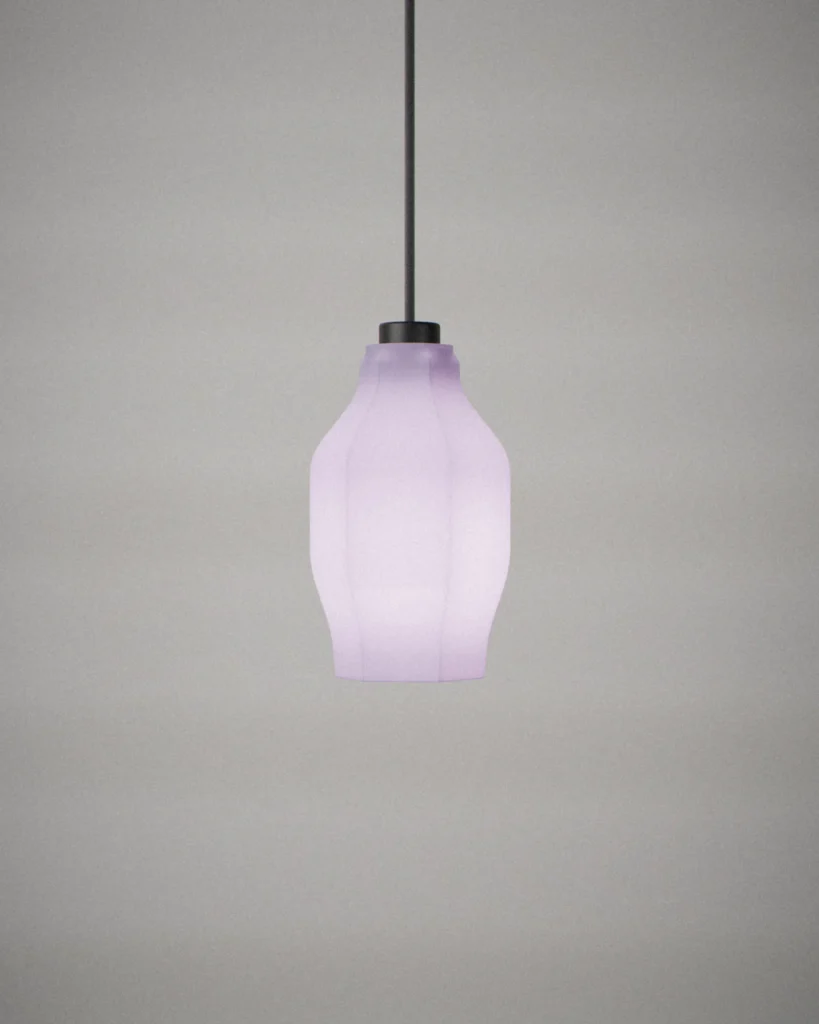 Hex, lit, on a pale grey wall