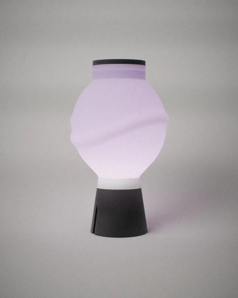 Ito, lit, on a pale grey wall