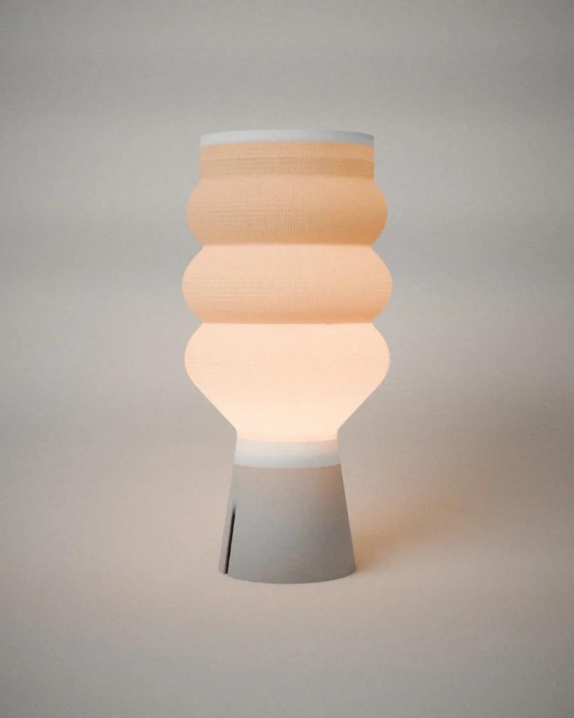 Rings, lit, on a pale grey wall