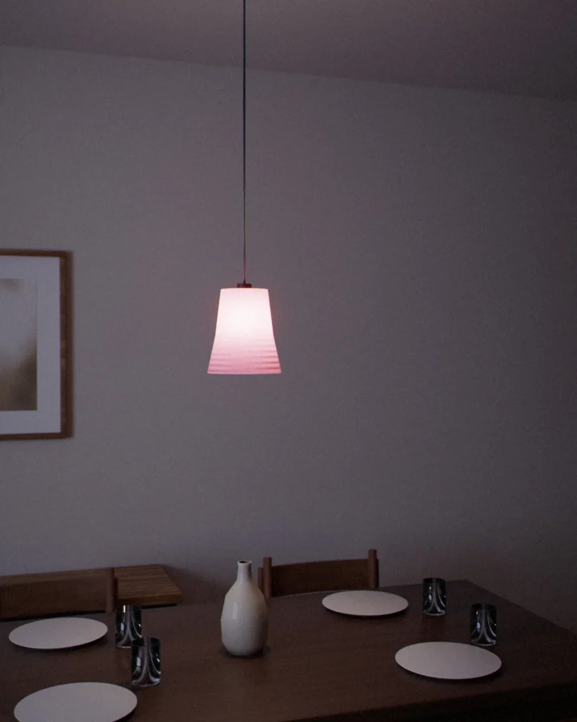 Shigure lit in a furnished room in the evening