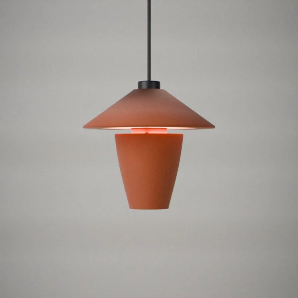 Spinner, lit, on a pale grey wall