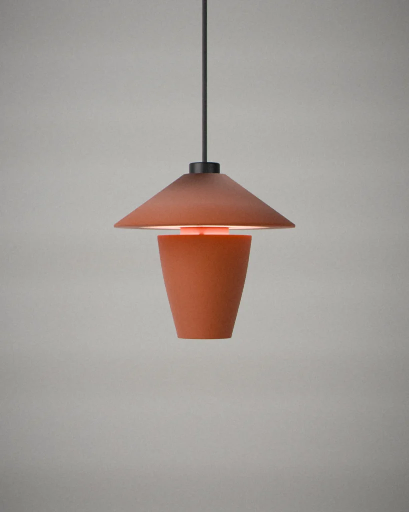 Spinner, lit, on a pale grey wall