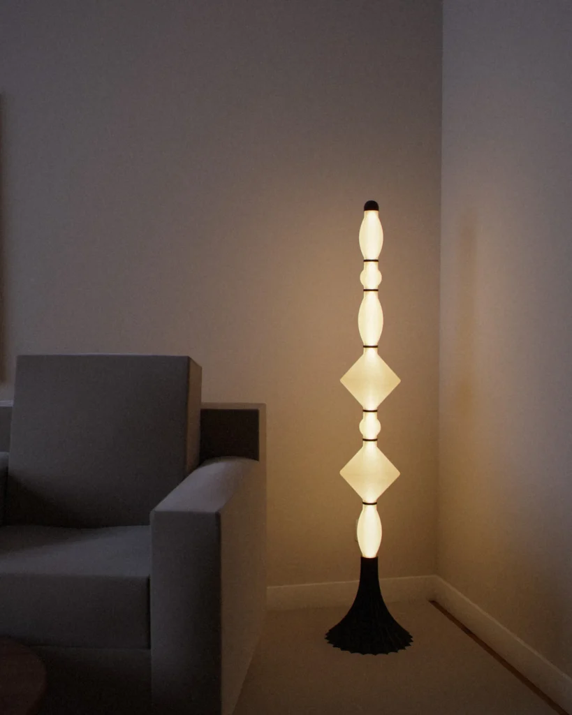 Totem lit in a furnished room in the evening