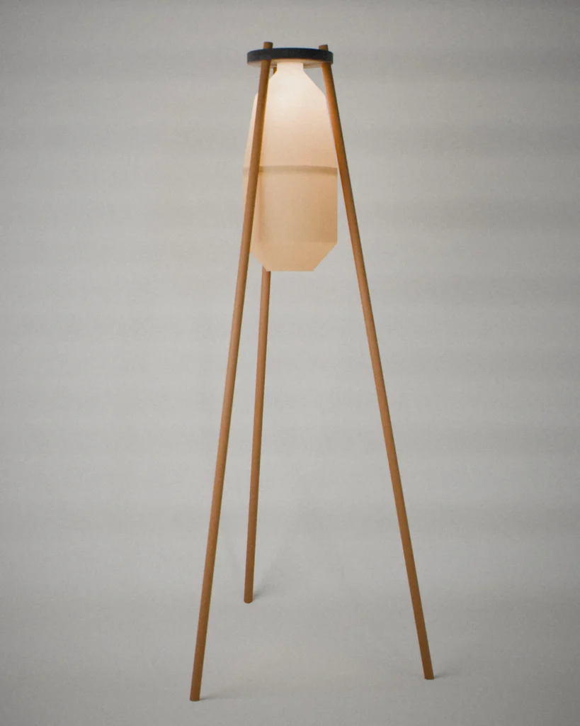 Tripod, lit, on a pale grey wall