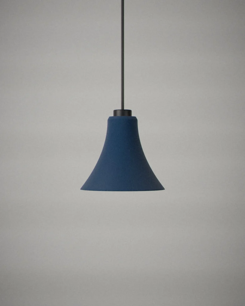 Trumpet, lit, on a pale grey wall