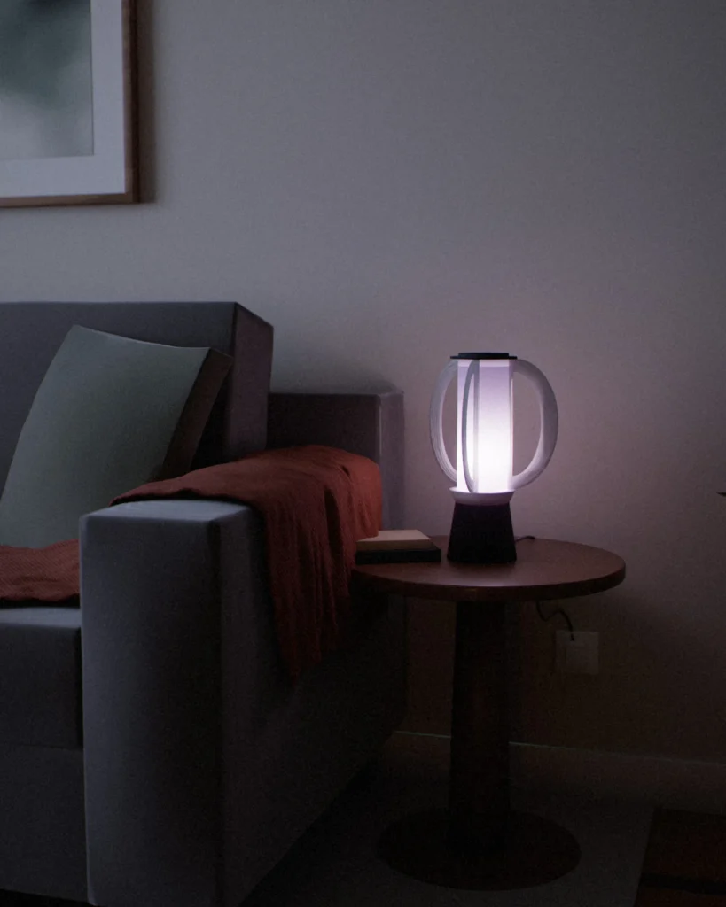 Tsuki lit in a furnished room in the evening