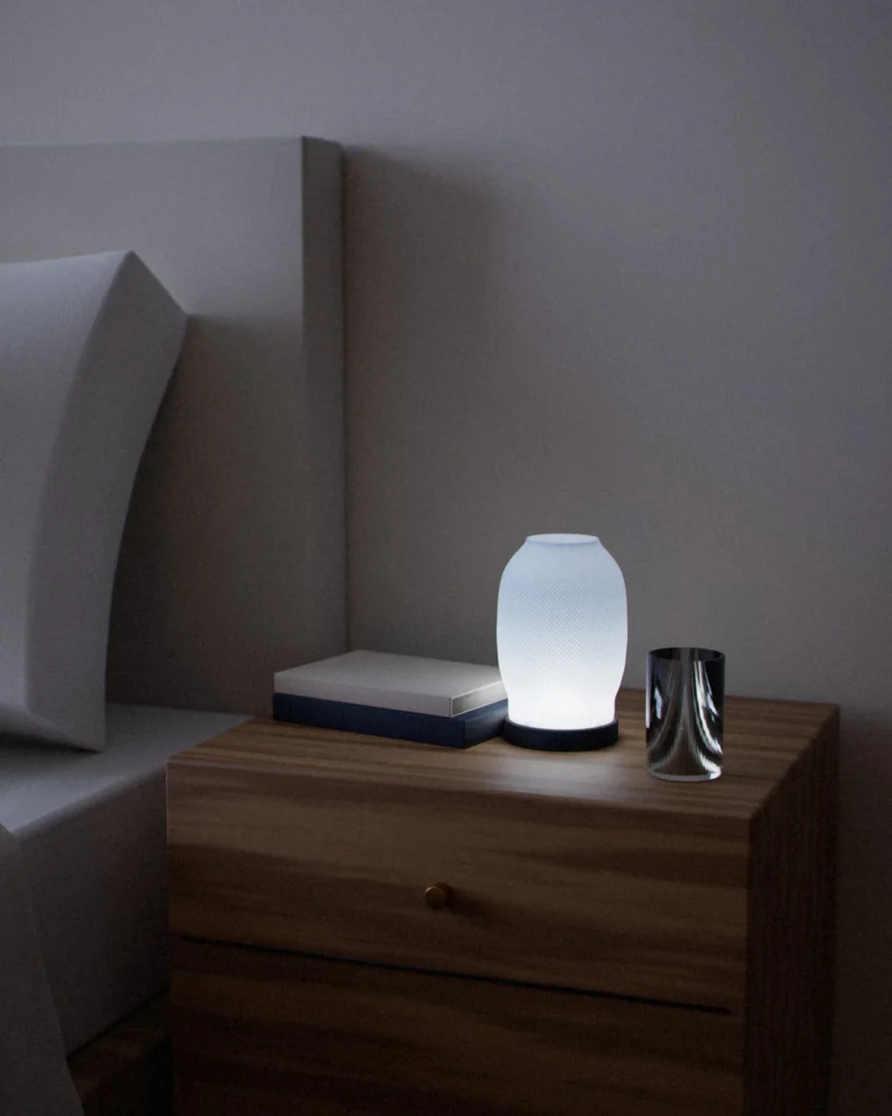 Tsumugi lit in a furnished room in the evening