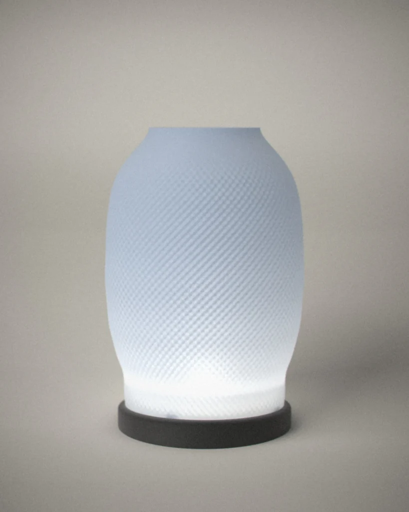 Tsumugi, lit, on a pale grey wall