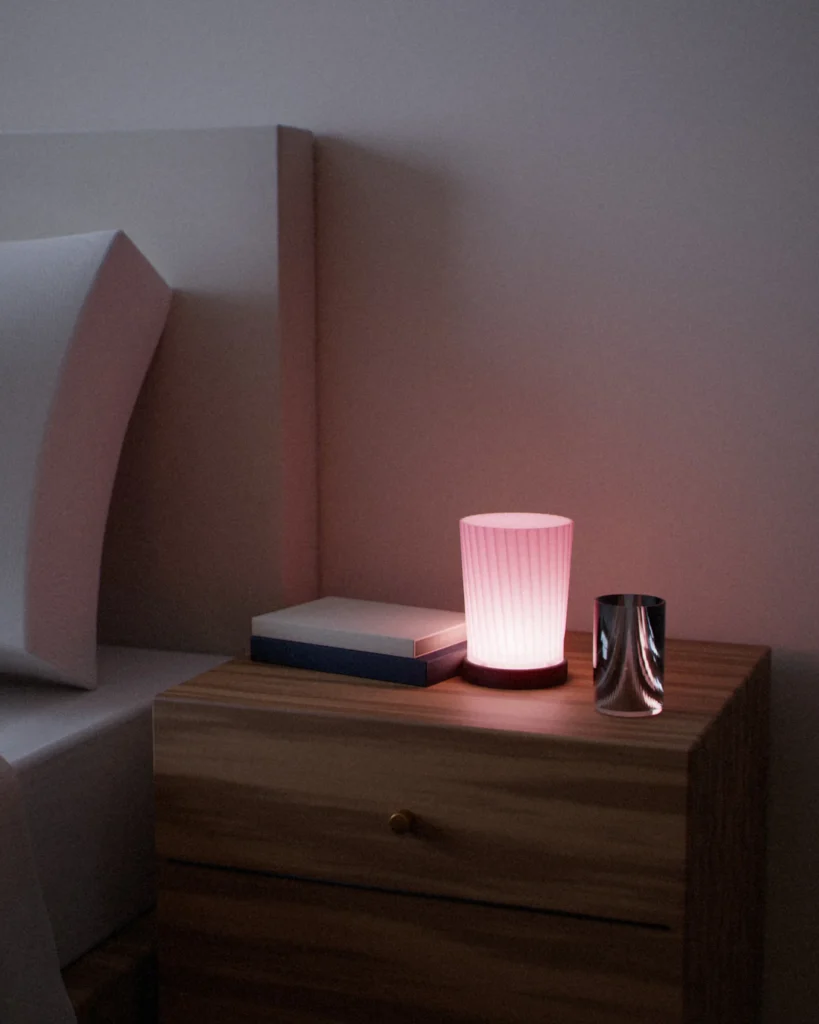 Tsutsu lit in a furnished room in the evening