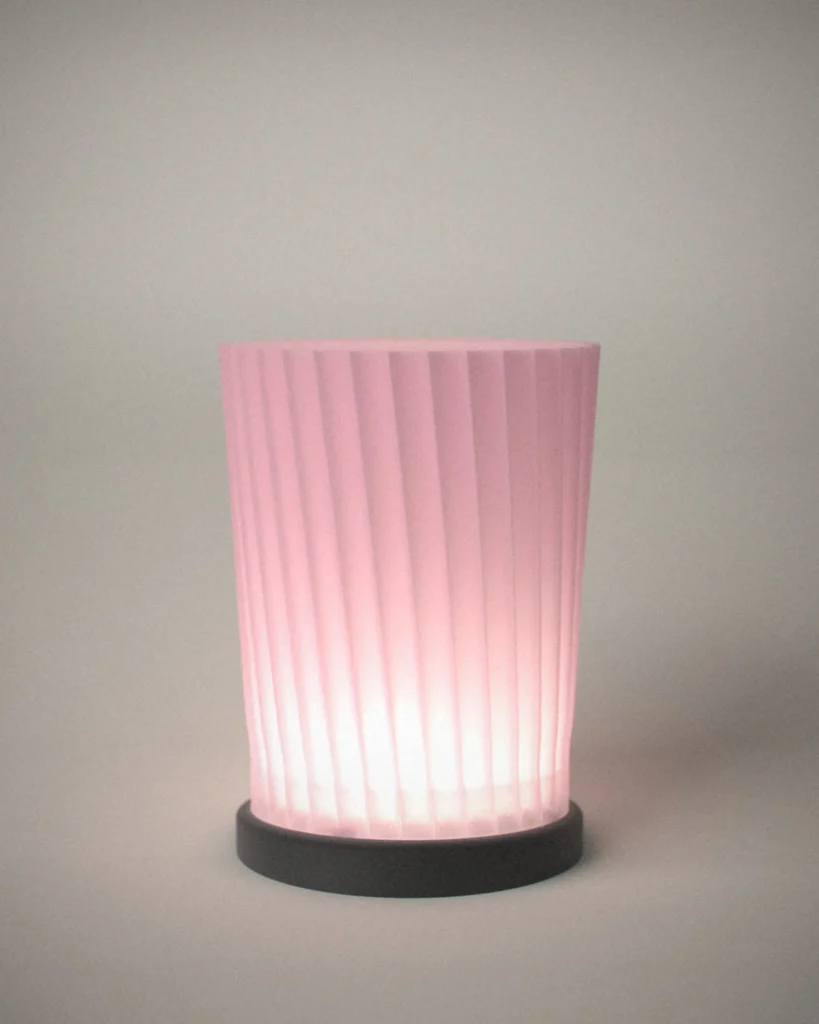 Tsutsu, lit, on a pale grey wall