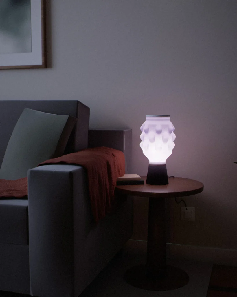 Uroko lit in a furnished room in the evening