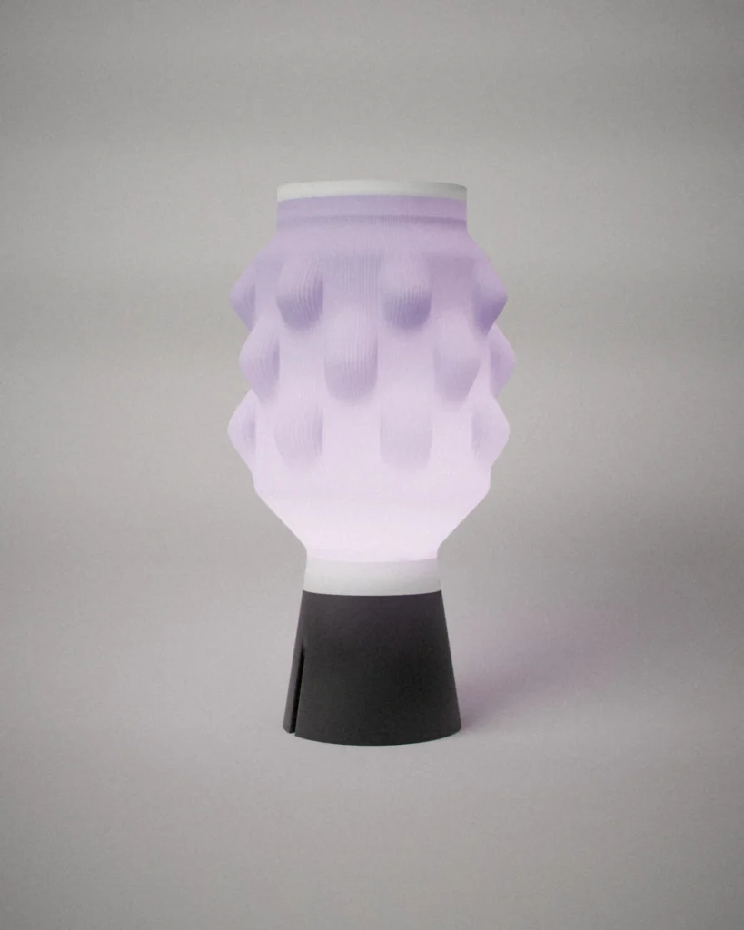 Uroko, lit, on a pale grey wall