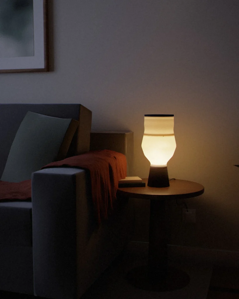 Vase lit in a furnished room in the evening