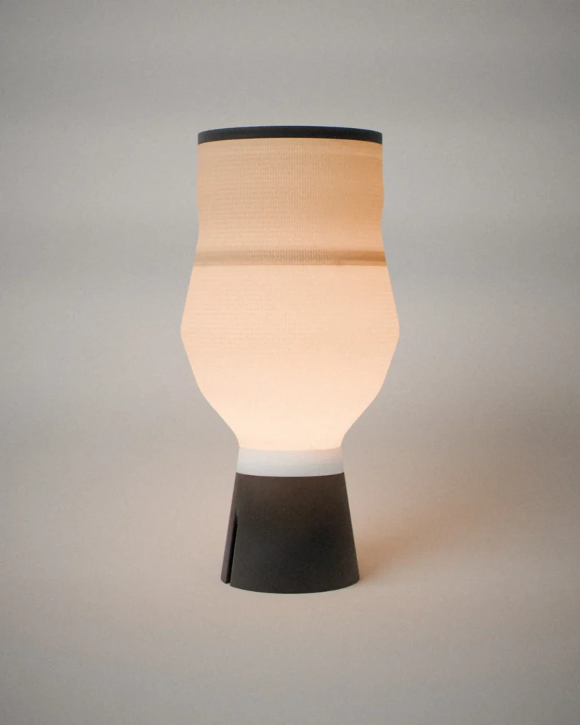 Vase, lit, on a pale grey wall