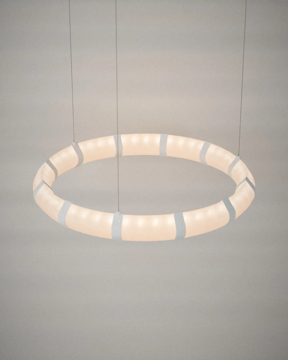 Wa ring chandelier, on a plain grey backdrop