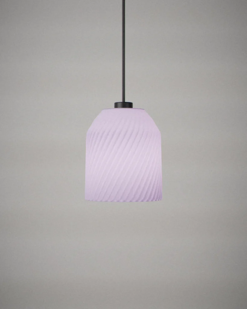 Yunomi, lit, on a pale grey wall